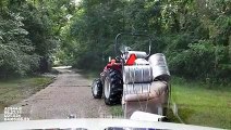 Crazy guy carrying barrels on a couch with a tractor... Why are cops arresting him??? ahaha