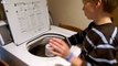 Autistic Boy Drumming on Washing Machine
