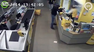 Armed robber gets shopping baskets thrown in his face.