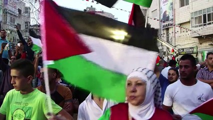 Palestinians celebrate as flag raised at UN