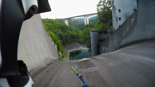 Bike ride down a dam Face right into the water