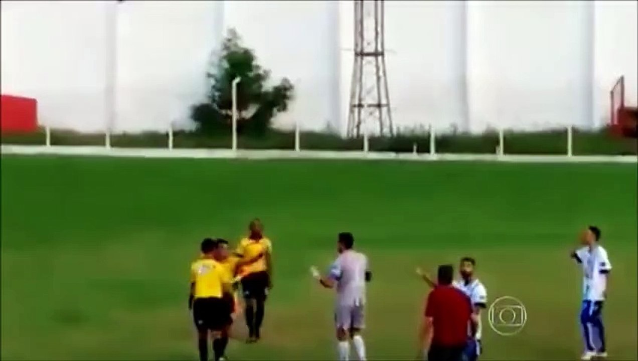 Referee (Retire Police man ) pulls out a GUN during football match in Brazil