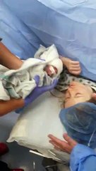 Mother Kisses Baby for First Time After Emergency Operation