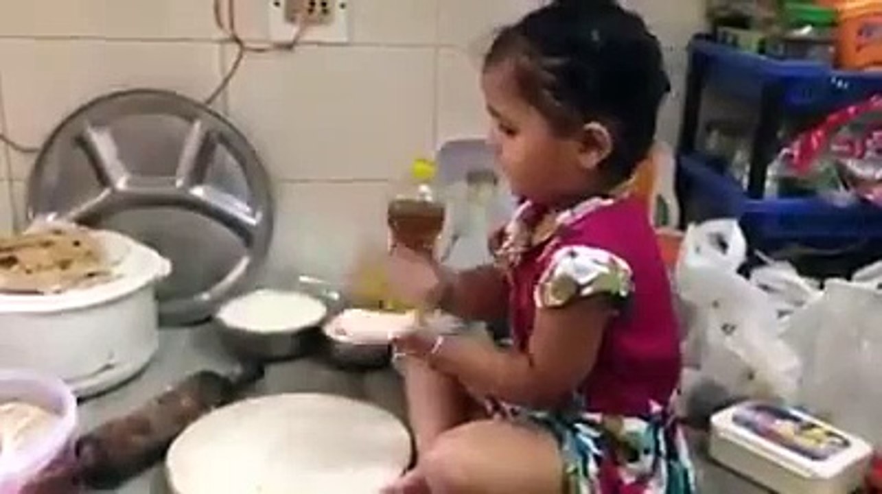 small baby work in kitchen