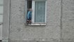 Crazy Russian Kid stands up on the edge of the window on 8th floor