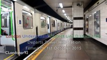 London Underground District Line D stock train departs eastbound at Tower Hill Station