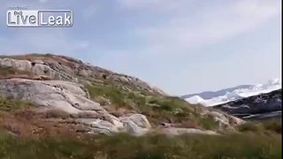 Behold the majestic beauty of a massive iceberg falling apart!