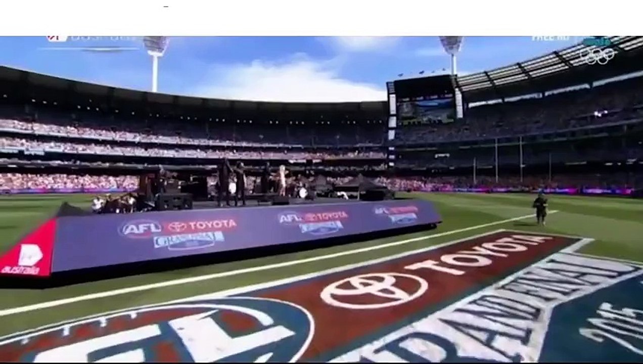 Lip-syncing Ellie Goulding performs at the AFL Grand Final