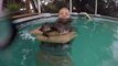 Luckiest Girl has massive hug with Baby Otters in pool