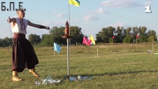 Zaporozhian cossack decapitates a plastic bottles with shashka