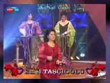 Emel TAŞÇIOĞLU *Bahçada Gül Ağacı* (Çiçekler Ekiliyor)