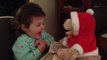 Precious toddler charmed by singing teddy bear