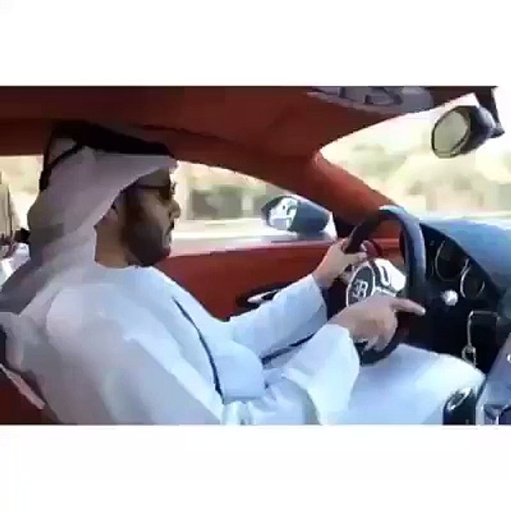 funny Arabic passing by a Bugatti veron