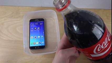 He Submerged His Phone In Coca Cola. I Couldn't Belive What Happened When He Took It Out