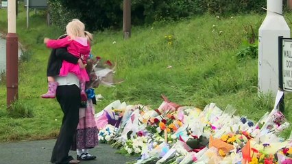 Family of PC Phillips lay flowers at scene of hit-and-run