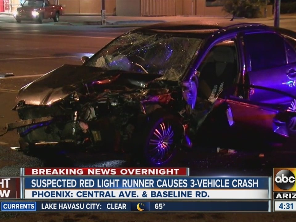 Suspected red light runner causes crash