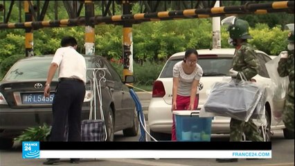 الصين: سكان تيانجين يرفضون العودة والسلطات تصر على محو آثار الكارثة!!