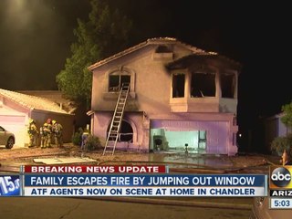 Family escapes fire by jumping out of window