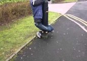 Man Tied to a Lamp Post With His Own Legs