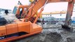 excavator stuck in deep mud and try to recovery by it self, amazing excavator at work