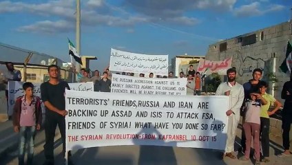 Kafranbel_demonstration against the Russian aggression burns the Russian flag10-10-2015