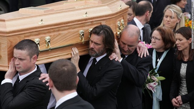 Jim Carrey carries coffin at Cathriona White's funeral