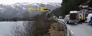 norwegian-medical-helicopter-lands-on-highway-guardrail-when-arriving-at-an-accident.-Fll3eURV9zY