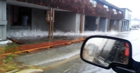 Waves wash through from underneath houses