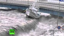 New dramatic video: Tsunami wave spills over seawall, smashes boats, cars