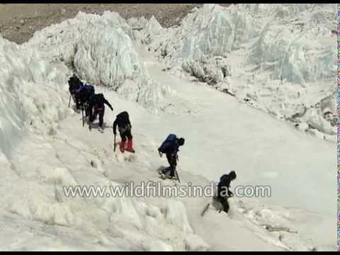 Climbers gingerly avoid crevasses in Everest glacier crossing