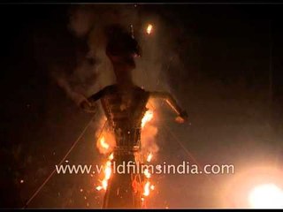 Crowd light firecrackers before burning effigies of Ravana, Kumbhakarna and Meghanada