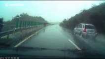 Dashcam captures shocking car roll on wet road in China