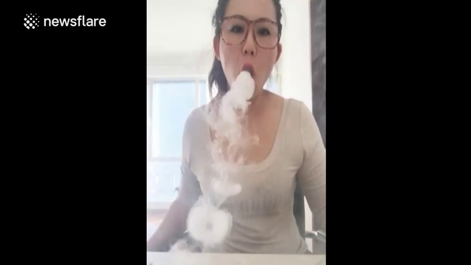 Woman blows smoke rings with e-cigarette to the beat of a dance song -  video Dailymotion