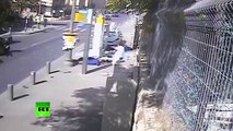 CCTV- Palestinian man rams car into bus stop, then attacks pedestrians with machete-like weapon