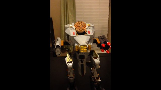 Yellow Lizard Sits Atop His Robot Throne