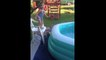 Little Girl adorably fails jumping into Inflatable Pool