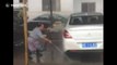 Happy car washer cleans cars with dancing martial arts moves
