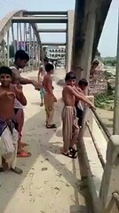 Little boys jump into river without fear