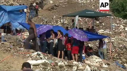 Rescuers search for 8 miners still trapped in gold mine