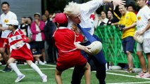 Boris knocks over young boy playing rugby in Tokyo