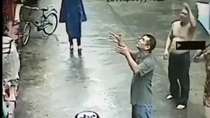Chinese Man Catches Baby Falling from Appartment Window