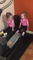 Twin girls take over elliptical machine