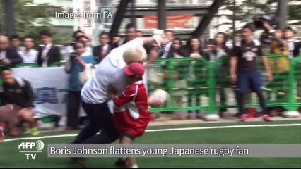 London mayor Boris flattens young Japanese rugby fan