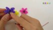 a cute daisy flower bracelet made from loom bands