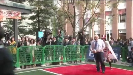 Boris Johnson knocks over Japanese child playing rugby
