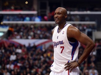 Lamar Odom wakes up, talks to Khloe Kardashian