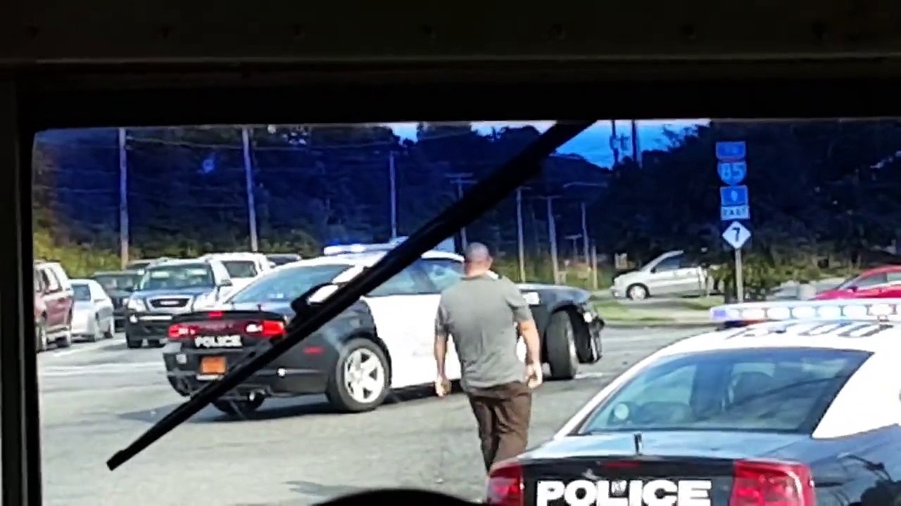 Gastonia NC woman drives in circles and crashes police car Bus view