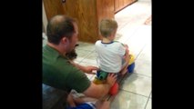 Dad Pushes Boy On Scooter, Puppy Pulls Him Back