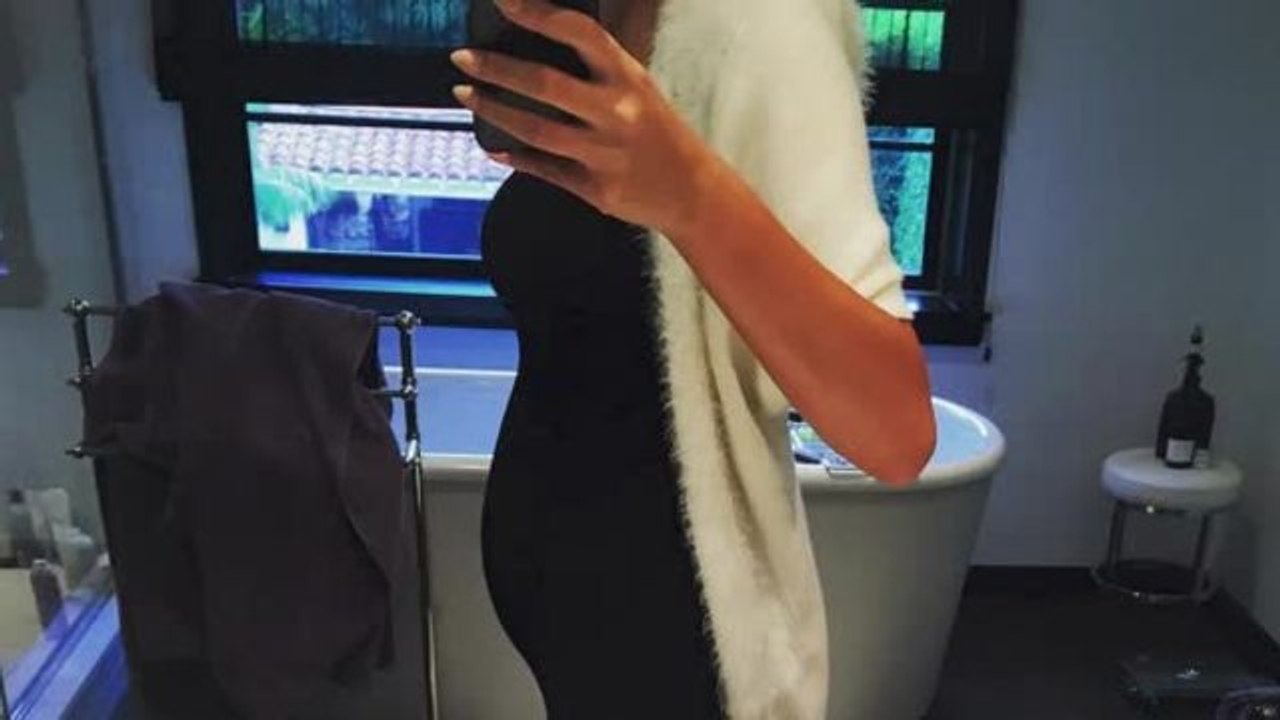 Pregnant Teigen Shuts Down Twin Talk