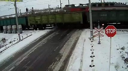 ACCIDENT OF THE YEAR Truck sandwiched between 2 trains